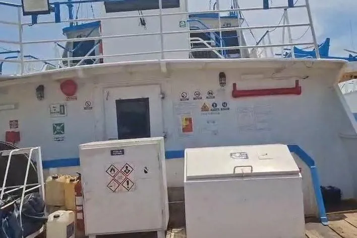  Yacht Photos Pics Custom built offshore crew vessel, 2009, with safety equipment and hazard signs on deck.