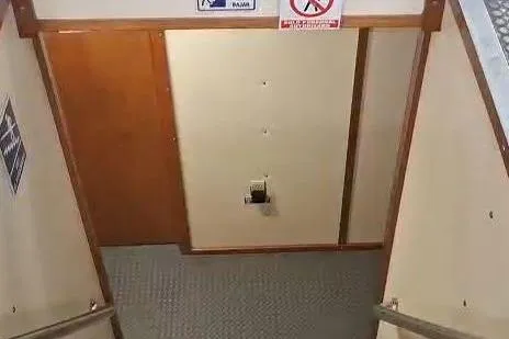  Yacht Photos Pics Staircase inside 2009 custom-built offshore crew vessel with safety signs.