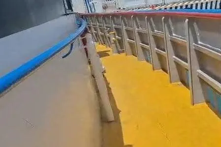  Yacht Photos Pics Custom built offshore crew vessel deck, 2009 model, with vibrant yellow flooring and safety railings.