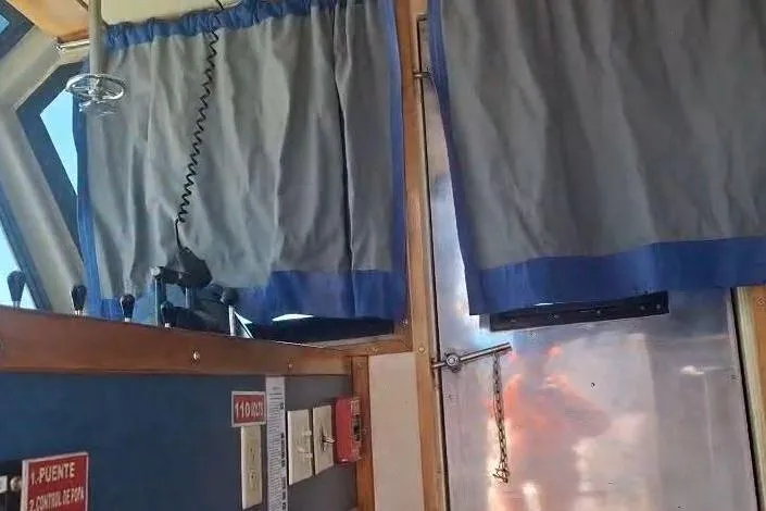  Yacht Photos Pics Interior of a 2009 custom-built offshore crew vessel with curtains and control panel.