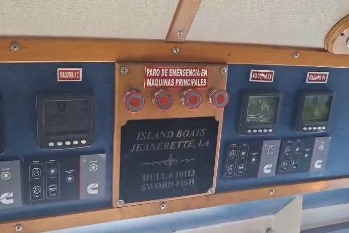  Yacht Photos Pics Control panel of a 2009 custom-built offshore crew vessel, featuring emergency stop buttons.