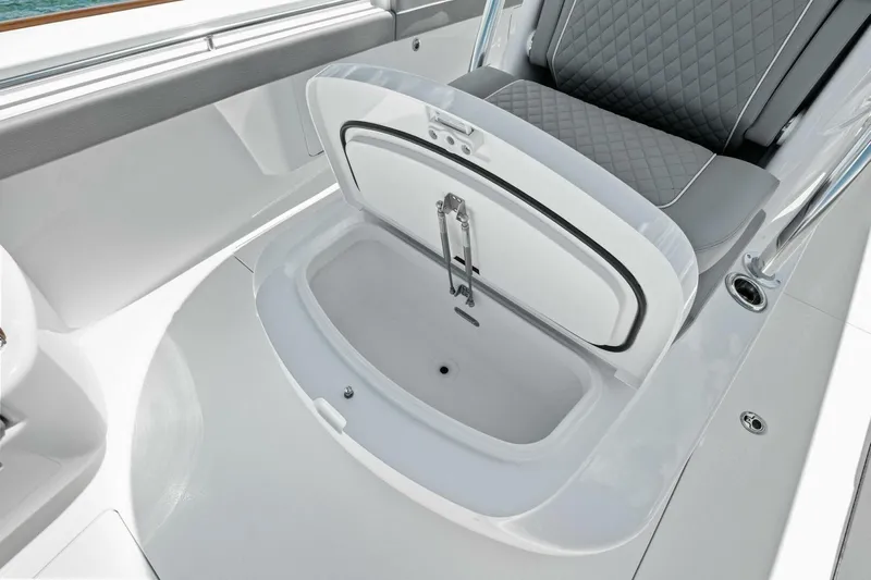 Galati Yacht Sales Trade Yacht Photos Pics Open storage compartment on 2025 Valhalla Boatworks V-37 with cushioned seating.