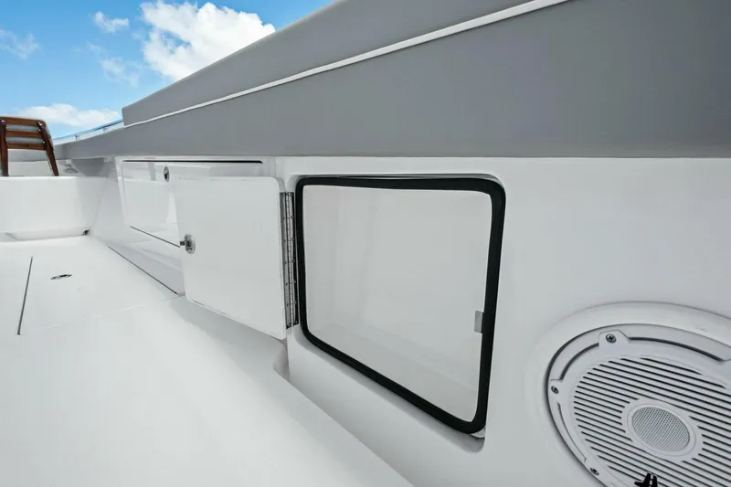 Galati Yacht Sales Trade Yacht Photos Pics 2025 Valhalla Boatworks V-37 deck with storage compartments and speaker.