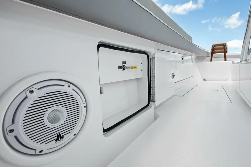 Galati Yacht Sales Trade Yacht Photos Pics 2025 Valhalla Boatworks V-37 interior with speaker and storage compartments.