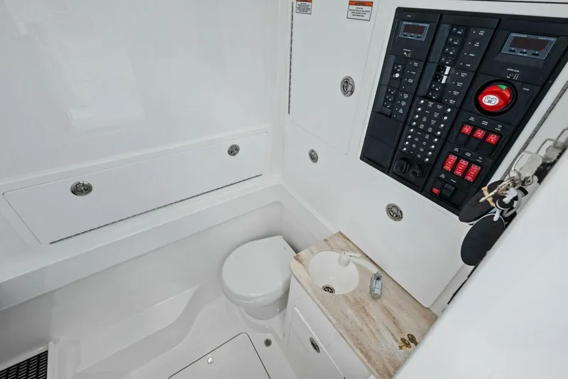 Galati Yacht Sales Trade Yacht Photos Pics 2025 Valhalla Boatworks V-37 interior with control panel, sink, and storage compartments.