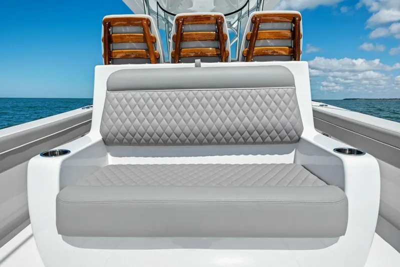 Galati Yacht Sales Trade Yacht Photos Pics 2025 Valhalla Boatworks V-37 with luxurious seating, ocean backdrop, and clear blue sky.