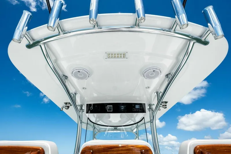 Galati Yacht Sales Trade Yacht Photos Pics 2025 Valhalla Boatworks V-37 helm with rod holders against blue sky.