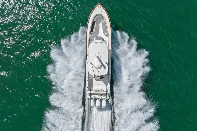 Galati Yacht Sales Trade Yacht Photos Pics Aerial view of 2025 Valhalla Boatworks V-37 cruising on turquoise water.