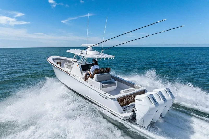 Galati Yacht Sales Trade Yacht Photos Pics 2025 Valhalla Boatworks V-37 cruising on open sea with triple Mercury engines.