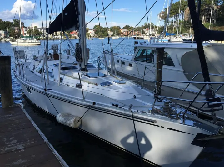 Dream Catcher Yacht Photos Pics Sailboat docked in marina, Hylas 46 model, 1995, with clear skies and calm waters.