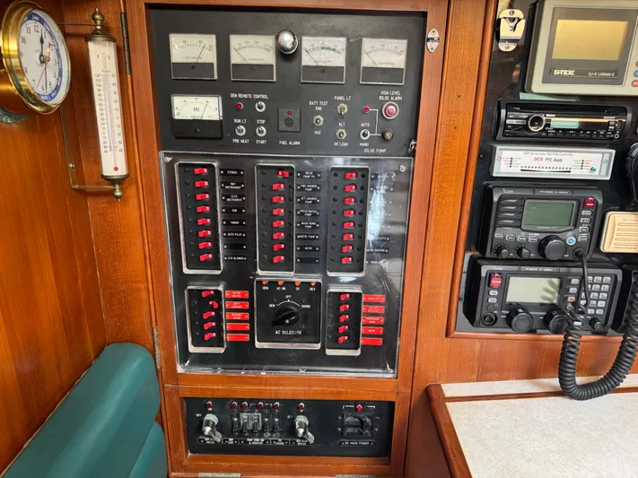 Dream Catcher Yacht Photos Pics Electrical control panel on a 1995 Hylas 46 yacht, featuring gauges and communication equipment.
