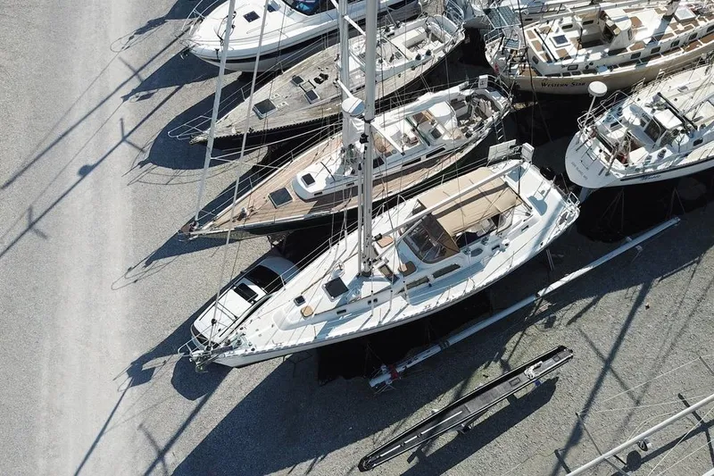 Dream Catcher Yacht Photos Pics Aerial view of a 1995 Hylas 46 sailboat docked among other boats.