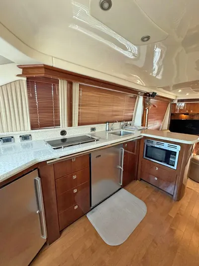  Yacht Photos Pics Interior of 2009 Sea Ray 58 Sedan Bridge yacht kitchen with modern appliances.
