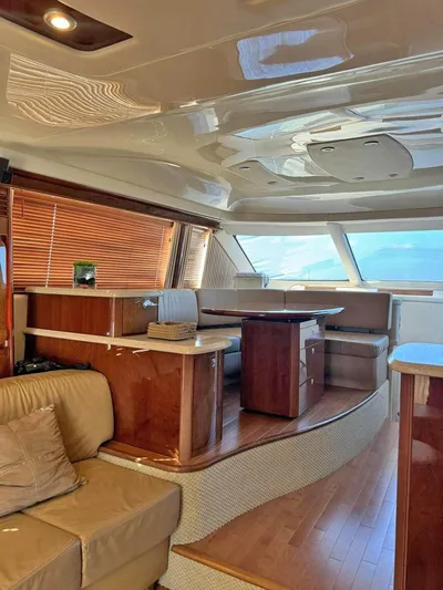  Yacht Photos Pics Luxurious interior of 2009 Sea Ray 58 Sedan Bridge yacht with wood accents.