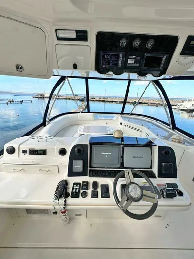  Yacht Photos Pics 2009 Sea Ray 58 Sedan Bridge helm with modern navigation equipment and ocean view.