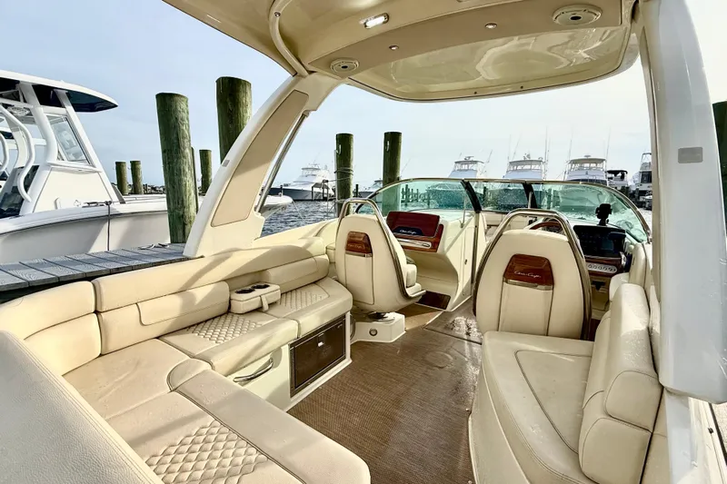  Yacht Photos Pics Luxurious 2022 Chris-Craft Launch 25 GT boat interior with elegant seating and helm.