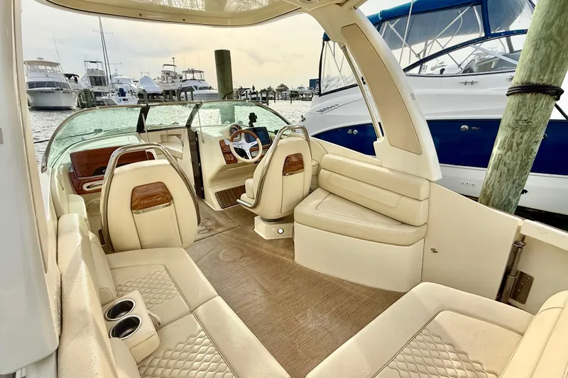  Yacht Photos Pics 2022 Chris-Craft Launch 25 GT boat interior with luxurious seating at marina.