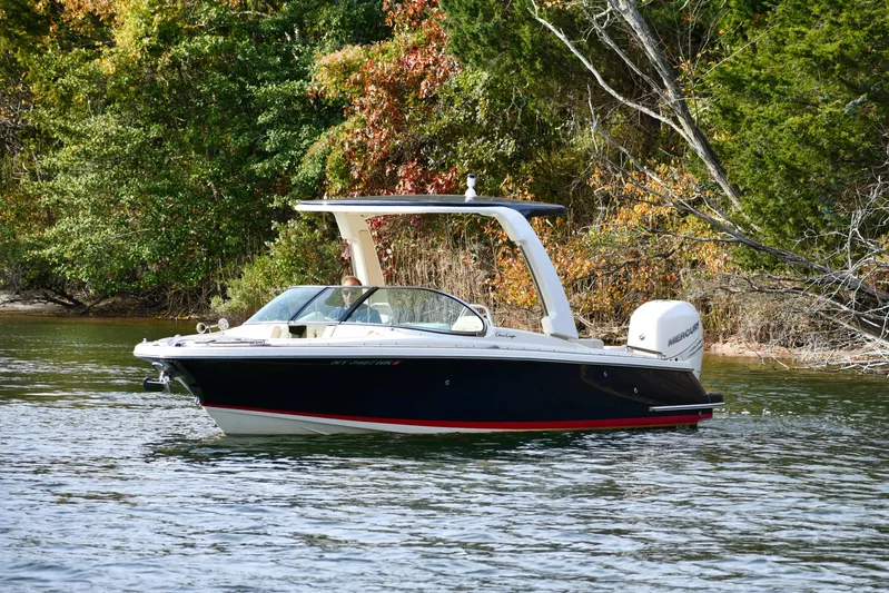  Yacht Photos Pics 2022 Chris-Craft Launch 25 GT boat on a scenic lake with autumn foliage.