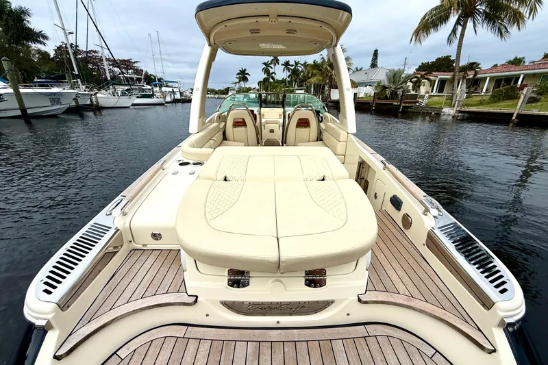  Yacht Photos Pics 2022 Chris-Craft Launch 25 GT boat with luxurious seating and teak deck in a marina.