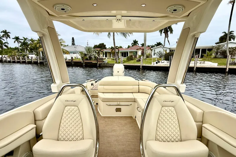  Yacht Photos Pics 2022 Chris-Craft Launch 25 GT boat interior with luxurious seating and waterfront view.
