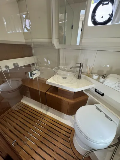 Bb Avanti Yacht Photos Pics 2023 Bluegame BG42 yacht bathroom with modern fixtures and wooden accents.