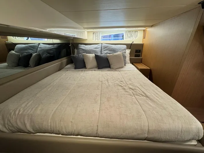 Bb Avanti Yacht Photos Pics Luxurious cabin interior of 2023 Bluegame BG42 yacht with cozy bedding and pillows.