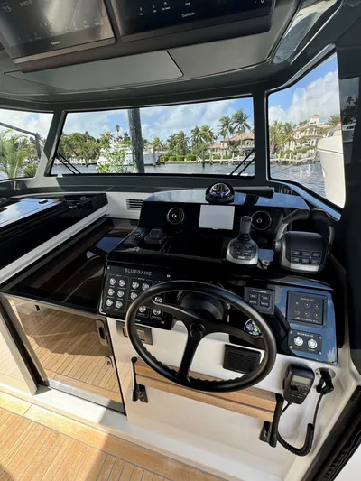 Bb Avanti Yacht Photos Pics 2023 Bluegame BG42 yacht helm with modern controls and panoramic view.