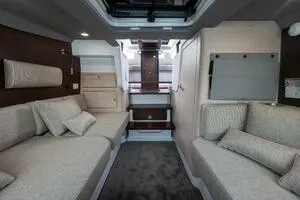 Stock 5 Yacht Photos Pics 2024 Axopar 45 interior cabin with modern seating and elegant design.