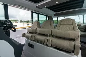 Stock 5 Yacht Photos Pics Interior of 2024 Axopar 45 boat with modern seating and steering console.