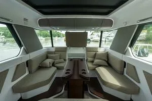 Stock 5 Yacht Photos Pics 2024 Axopar 45 interior with modern seating and panoramic windows.