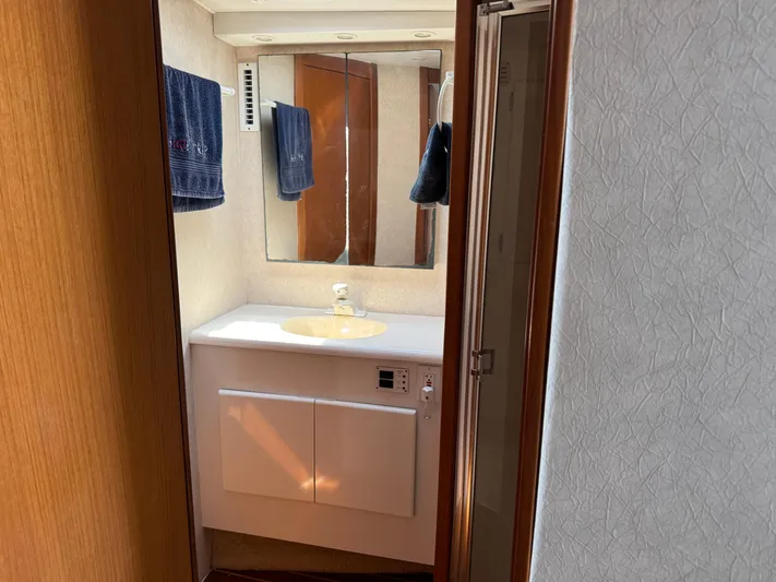  Yacht Photos Pics Bathroom interior of 1998 Post 42 Convertible yacht with sink and mirror.