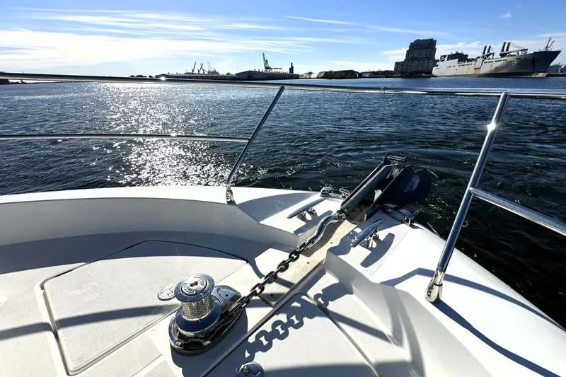 Treasure Key Yacht Photos Pics Bow of 2016 Prestige 550 yacht with ocean view and city skyline.