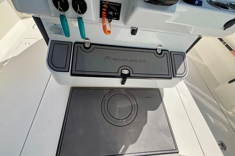  Yacht Photos Pics 2024 World Cat 325 CC boat interior with branded storage compartments and control panel.