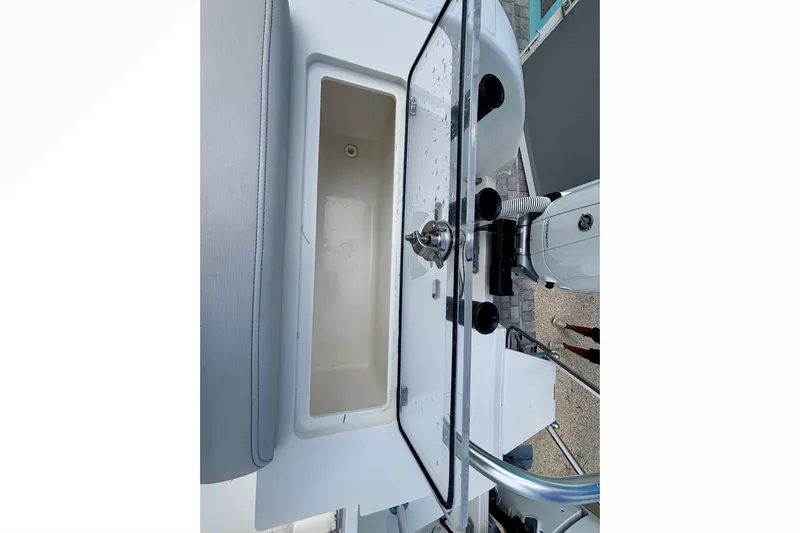  Yacht Photos Pics 2024 World Cat 325 CC boat interior with storage compartment and equipment.