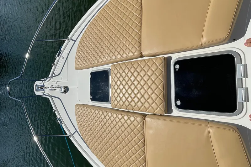  Yacht Photos Pics 2010 Pursuit OS 375 Offshore boat with tan cushioned deck, viewed from above.