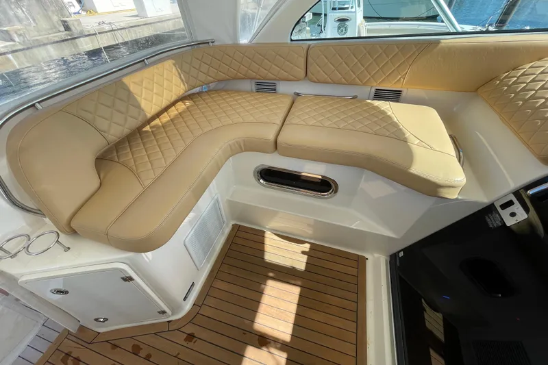  Yacht Photos Pics Luxurious seating on 2010 Pursuit OS 375 Offshore boat with tan quilted upholstery.