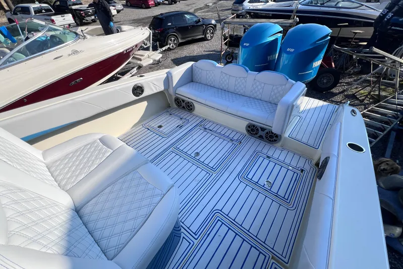  Yacht Photos Pics 2014 Statement 350 Open boat interior with white seating and Yamaha engines.