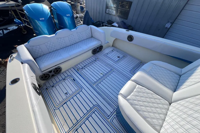  Yacht Photos Pics Luxurious 2014 Statement 350 Open boat interior with white quilted seating and blue V8 engines.