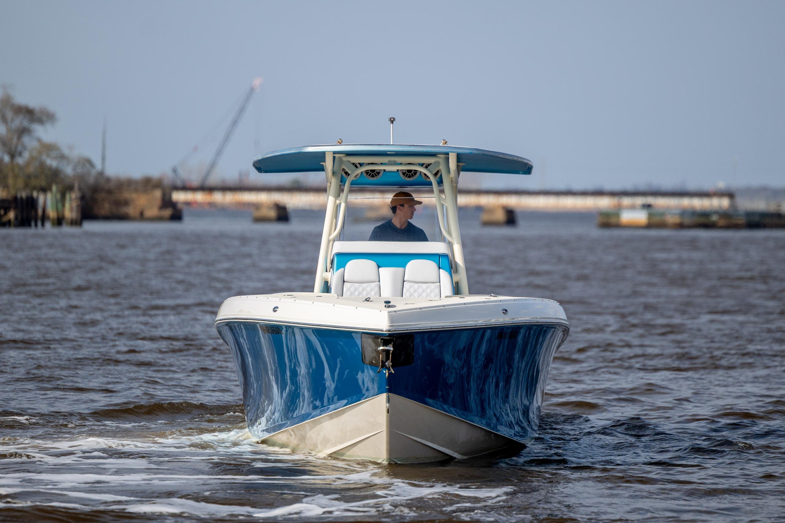 2014 Statement 350 Open boat cruising on a calm river.