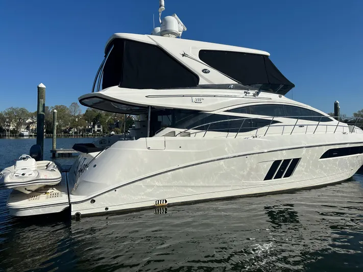 Working Late Yacht Photos Pics 2016 Sea Ray L590 Fly yacht docked on calm water.