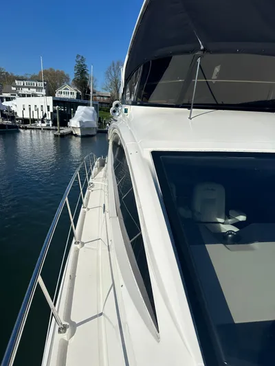 Working Late Yacht Photos Pics 2016 Sea Ray L590 Fly yacht docked at marina, showcasing sleek design and spacious deck.