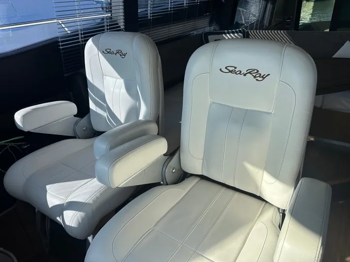 Working Late Yacht Photos Pics Luxurious white leather seats on a 2016 Sea Ray L590 Fly yacht.