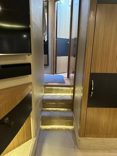 Working Late Yacht Photos Pics Interior view of 2016 Sea Ray L590 Fly yacht, featuring modern wood paneling and sleek design.