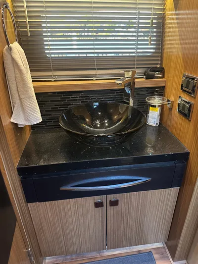 Working Late Yacht Photos Pics Luxurious bathroom sink area in 2016 Sea Ray L590 Fly yacht.