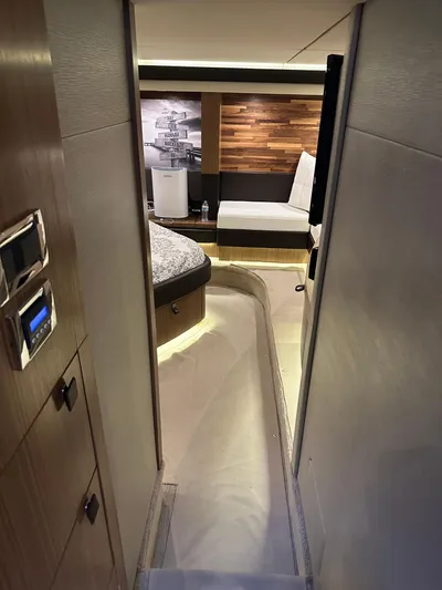 Working Late Yacht Photos Pics Interior view of 2016 Sea Ray L590 Fly yacht, featuring modern design and cozy seating area.