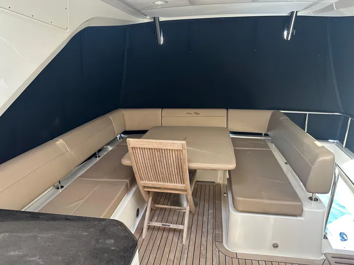 Working Late Yacht Photos Pics 2016 Sea Ray L590 Fly yacht with outdoor seating and dining area.