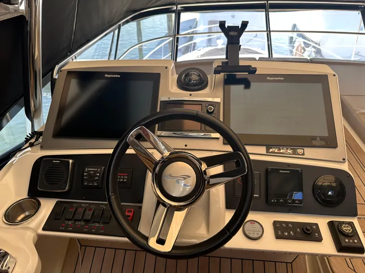Working Late Yacht Photos Pics Helm of 2016 Sea Ray L590 Fly yacht with dual navigation screens and controls.