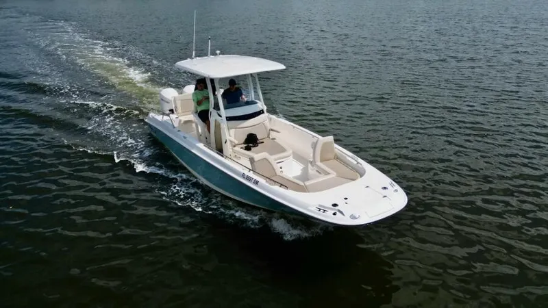  Yacht Photos Pics 2019 Boston Whaler DAUNTLESS boat cruising on open water.