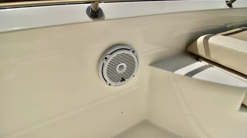  Yacht Photos Pics 2019 Boston Whaler DAUNTLESS boat interior with speaker and seating area.