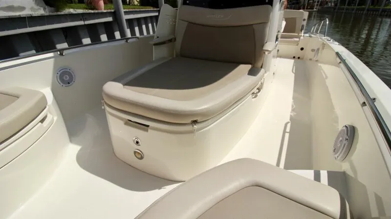  Yacht Photos Pics 2019 Boston Whaler DAUNTLESS boat interior with cushioned seating and storage.